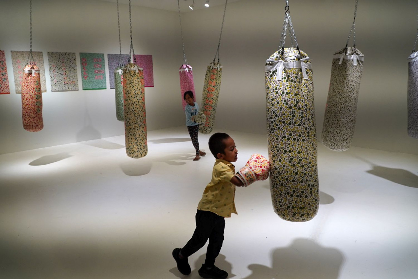 Kinetic art: Children interact with I (don't) SEE COLOUR, an art installation by Bibiana Lee, on July 4 at the Artjog 2023 festival at the Jogja National Museum in Yogyakarta.