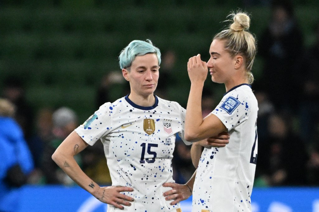 USA's forward Megan Rapinoe (left) and midfielder Kristie Mewis (right) react at the end of the Australia and New Zealand 2023 Women's World Cup round of 16 soccer match between Sweden and USA at Melbourne Rectangular Stadium in Melbourne on August 6, 2023.