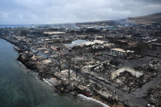 An aerial image taken on August 10, 2023 shows destroyed homes and buildings on the waterfront burned to the ground in Lahaina in the aftermath of wildfires in western Maui, Hawaii, US. 