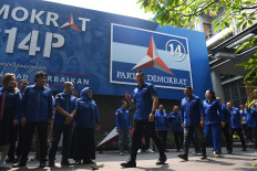Democratic Party chairman Agus Harimurti Yudhoyono (center) arrives at the party headquarters in Menteng, Central Jakarta ahead of a press briefing on August 11, 2023.