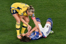 Sweden's defender #06 Magdalena Eriksson consoles Japan's midfielder #15 Aoba Fujino after the end of the Australia and New Zealand 2023 Women's World Cup quarter-final football match between Japan and Sweden at Eden Park in Auckland on August 11, 2023.