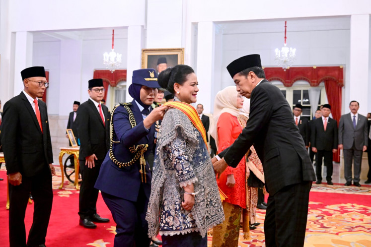 President Joko “Jokowi” Widodo bestows the Bintang Republik Indonesia Adipradana on First Lady Iriana at the State Palace in Jakarta in August 2023.
