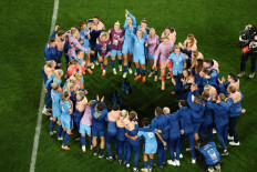 England's team celebrates winning the Australia and New Zealand 2023 Women's World Cup semi-final soccer match between Australia and England at Stadium Australia in Sydney on Aug. 16, 2023.