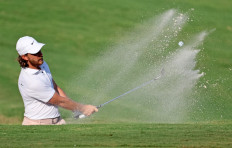 Tommy Fleetwood of England plays a shot from a bunker on the 16th hole during the final round of the FedEx St. Jude Championship at TPC Southwind on Aug. 13, 2023, in Memphis, Tennessee, the United States. 