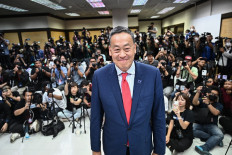 The Pheu Thai Party's Srettha Thavisin (center), approved by Thai lawmakers to become the kingdom's 30th prime minister, greets supporters and members of the media at the party headquarters after the parliament's prime ministerial vote in Bangkok on Aug. 22, 2023. Thai lawmakers approved tycoon Srettha Thavisin as the kingdom's new prime minister on Aug. 22, ending three months of political deadlock, on the same day former premier Thaksin Shinawatra returned from exile.

