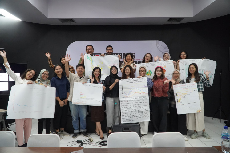 Workshop participants pose for a group photo following the “Data Journalism: Turning Numbers into Narratives” session of The Jakarta Post’s “Media Literacy Bootcamp”, which highlights the use of data visualization tools to identify trends and insights.