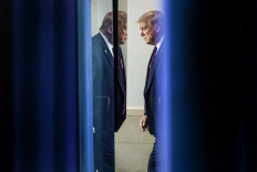 US President Donald Trump arrives to speak at the press briefing at the White House in Washington, DC, on July 30, 2020. Donald Trump said he will turn himself in on August 24, 2023 in Georgia to face racketeering and other charges stemming from his bid to overturn the 2020 election.
