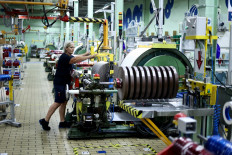 An employee works at a Rizla+ factory of cigarette papers in Anvers, Belgium, on July 6, 2023.