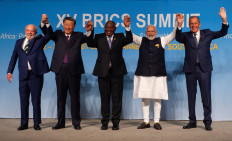 Brazil President Luiz Inacio Lula da Silva (left), China's President Xi Jinping (second left), South African President Cyril Ramaphosa (center), Indian Prime Minister Narendra Modi (second right) and Russia's Foreign Minister Sergei Lavrov pose for a picture at the BRICS Summit in Johannesburg, South Africa on Aug. 23, 2023. 