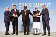 President of Brazil Luiz Inacio Lula da Silva, President of China Xi Jinping, South African President Cyril Ramaphosa, Prime Minister of India Narendra Modi and Russia's Foreign Minister Sergei Lavrov (left to right) pose for a BRICS family photo during the 2023 BRICS Summit at the Sandton Convention Centre in Johannesburg on August 23, 2023.