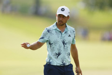 Xander Schauffele of the United States reacts on the 14th green during the final round of the Tour Championship at East Lake Golf Club on Aug. 27, 2023 in Atlanta, Georgia, the United States. 