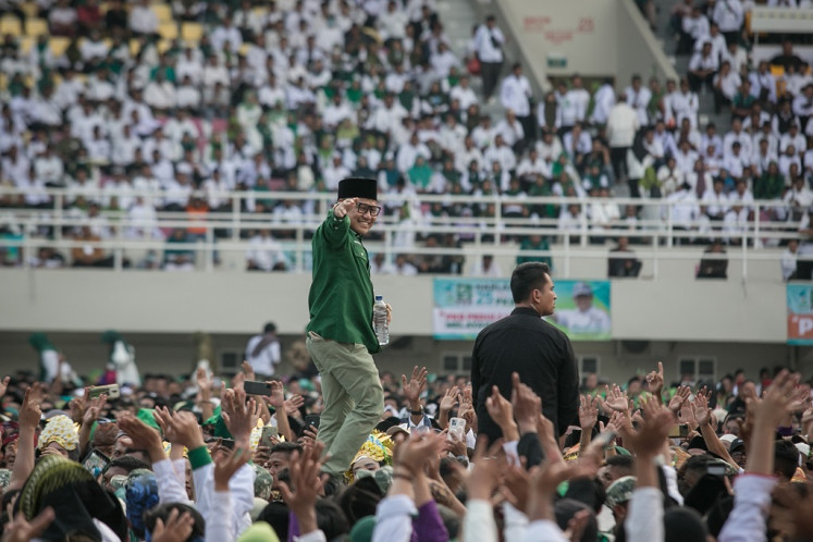 National Awakening Party (PKB) chairman Muhaimin Iskandar greets party members during the celebration of the party's 25th anniversary at Manahan Stadium in Surakarta, Central Java, on July 23, 2023.