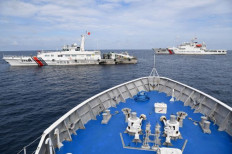 Close quarters: Philippine Coast Guard vessel BRP Cabra encounters two Chinese Coast Guard ships blocking its path on Aug. 22, while sailing to Second Thomas Shoal in the disputed South China Sea.