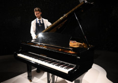 Freddie Mercury's Yamaha G-2 baby grand piano, is pictured during a press preview ahead of the “Freddie Mercury: A World of His Own“ auctions, at Sotheby's auctioneers in London on August 3, 2023. 