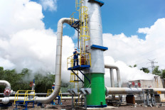 Technicians inspect a steam separator on April 25, 2022 at the Lahendong Geothermal Power Plant belonging to state-owned energy giant Pertamina in Lahendong, Tomohon, North Sulawesi.