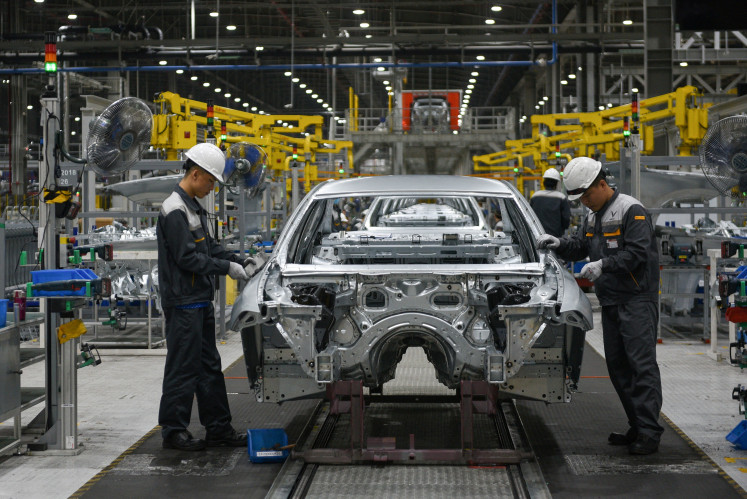 Laborers work in VinFast's factory in Hai Phong City, Vietnam, on April 22, 2021.