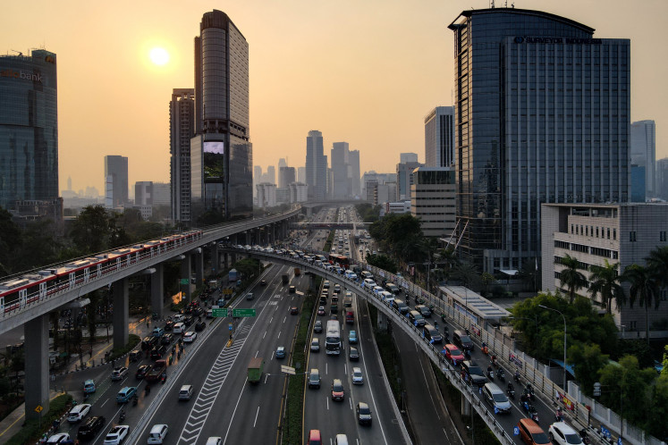 This aerial picture shows motorists commuting during the rush hour in Jakarta on Aug. 29, 2023.