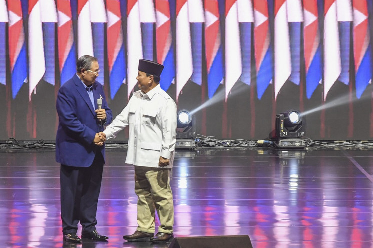 Former president and Democratic Party founder Susilo Bambang Yudhoyono (left) shakes hand with Gerindra Party chairman Prabowo Subianto (right) on Sept. 21, 2023, during a Democratic Party leadership meeting in Jakarta.