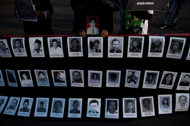 Portraits of injustice: Members of the Victims Solidarity Network for Justice (JSKK) display the pictures of victims of past human rights violations during a rally outside the State Palace on Sept. 14, 2023. It was the 787th edition of the protest, which is held every Thursday.