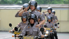 Several Policewomen (Polwan) initiating practice using motorcycles during the inauguration of patrol policewoman in the Police Headquarters of Blitar, East Java, on Friday (24/3). 
