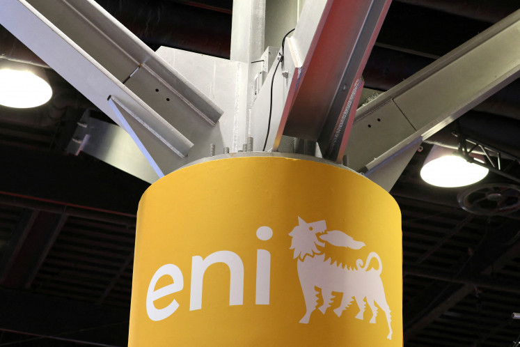 The logo of Italian multinational energy company Eni is displayed at a booth during the LNG 2023 energy trade show in Vancouver, Canada, on July 12, 2023.