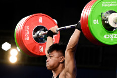 Indonesia's Rahmat Erwin Abdullah competes in the mens 73-kg group A weightlifting competition during the 2022 Asian Games in Hangzhou, in China's eastern Zhejiang province on Oct.3, 2023.