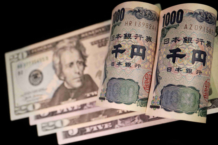 Japanese yen and US dollar banknotes are seen in this illustration picture taken on Sept. 23, 2022.