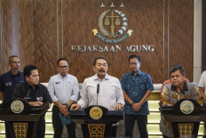 Attorney General ST Burhanuddin (center) speaks to journalists during a press briefing with State-Owned Enterprises (SOEs) Minister Erick Thohir (left) and Development Finance Comptroller (BPKP) head Yufu Ateh at the Attorney General's Office (AGO) in Jakarta on Oct. 3, 2023. Erick handed over an audit report that found the management of retirement funds in four SOEs problematic and potentially caused Rp 300 billion (US$18.71 billion) in state losses.