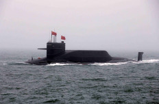 FILE PHOTO: FILE PHOTO: Chinese Navy's nuclear-powered submarine Long March 11 takes part in a naval parade off the eastern port city of Qingdao, to mark the 70th anniversary of the founding of Chinese People's Liberation Army Navy, China, April 23, 2019. REUTERS/Jason Lee/File Photo To match Special Report USA-CHINA-TECH/SURVEILLANCE/File Photo