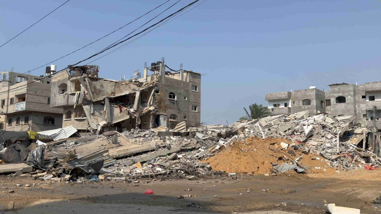 Damaged buildings and rubble are seen in the aftermath of an Israeli strike in Gaza City, October 8, 2023, in this still image obtained from a video.