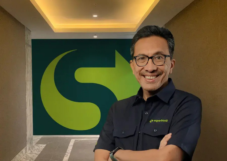 Ready to run: Superbank president director Tigor Siahaan poses with the Superbank logo in this undated photo.