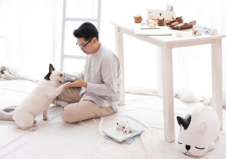 Global, then local: Kurobokan founder Paulus Hyu plays with his French bulldog, which inspired his Nimbus series. While the company relies mainly on overseas buyers, Paulus believes more customers enthusiastic about collectibles will emerge in and grow the domestic market.