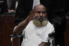 Former Papua governor Lukas jailed for eight years for bribery