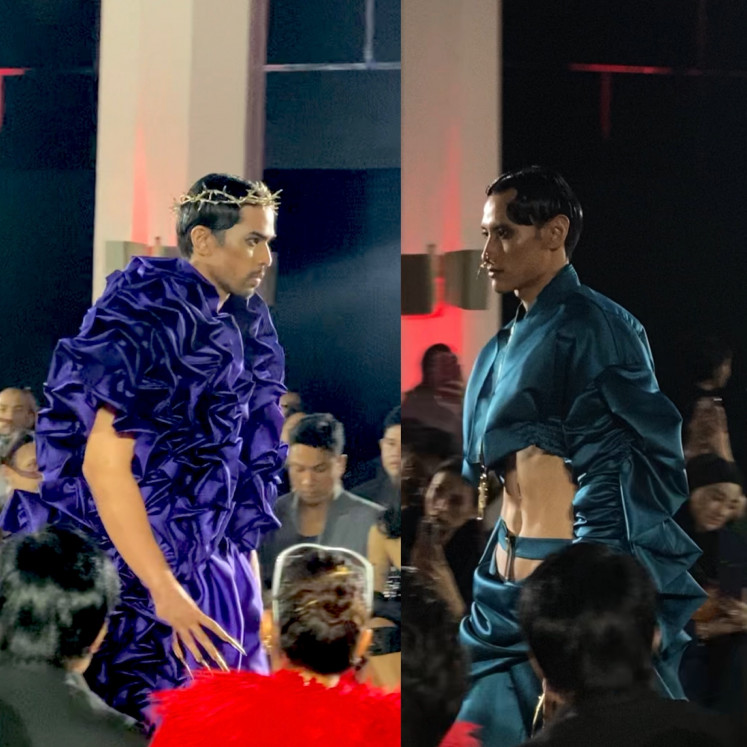 Models present creations in bold violet and deep blue-green on Oct. 17, during an interludial segment of a fashion show at Bengkel Square in South Jakarta presenting Harry Halim’s “White Lies” spring/summer 2024 collection, which was dominated by a monochromatic color scheme.