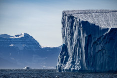 A photograph taken on Aug. 12, 2023 shows an iceberg melting in Scoresby Fjord, Estarn Greenland.