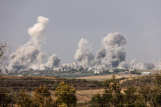 A picture taken from the southern Israeli city of Sderot on October 23, 2023, shows smoke and debris ascending over the northern Gaza Strip following an Israeli strike, amid the ongoing battles between Israel and the Palestinian group Hamas. 