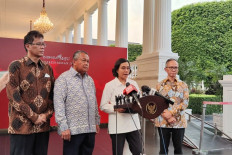 Financial System Stability Committee (KKSK) chairwoman and Finance Minister Sri Mulyani Indrawati (second right) gives a press statement at the Presidential Palace complex in Jakarta on Oct. 23, 2023. 