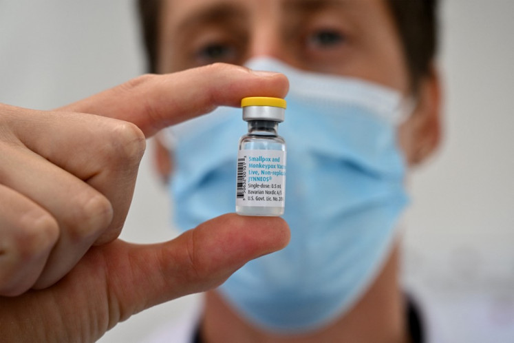 A doctor poses with a monkeypox vaccine vial at a Centre gratuit d'information, de d&eacute;pistage et de diagnostic (CeGIDD) in Montpellier, southern France on Aug. 23, 2022.