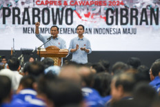 Presumptive presidential nominee Prabowo Subianto (left) and his running mate Gibran Rakabuming Raka (right) deliver a speech during their announcement as a candidate pair in next year's election at Indonesia Arena multipurpose indoor stadium on Oct. 25, 2023. Prabowo and Gibran registered themselves with the General Elections Commission (KPU) on the same day to run in the 2024 presidential election.