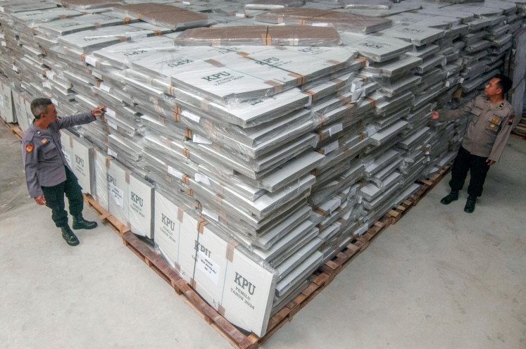 Poll essentials: Police officers check knocked-down pooling booths on October 24, 2023 as they inspect the storehouse of the local General Elections Commission (KPU) in Boyolali, Central Java. Boyolali received 13,706 pooling booths for next year’s elections.