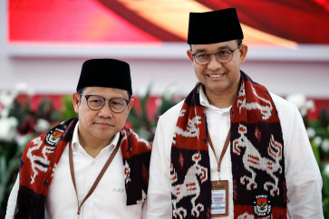 Anies Baswedan, former Jakarta governor and candidate in next year's presidential election, and his running mate Muhaimin Iskandar, who is the chairman of the National Awakening Party (PKB),  pose as they register at the General Election Commission headquarters in Jakarta on Oct. 19, 2023. 