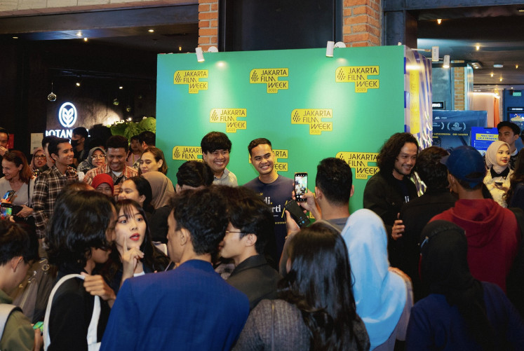 Joining the festivities: Jakarta's moviegoers visiting Jakarta Film Week 2023 take photos with the cast and crew of Indonesian family drama 'Budi Pekerti&rsquo;, which was screened as the opening film of the festivity at CGV Grand Indonesia, Central Jakarta, on Oct. 25. Jakarta Film Week 2023 took place at CGV Grand Indonesia, Galeri Indonesia Kaya and Kineforum Taman Ismail Marzuki until Oct. 29.
