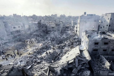 This image grab taken from AFPTV video footage shows Palestinians checking the destruction in the aftermath of an Israeli strike on the Jabalia refugee camp in the Gaza Strip, on November 1, 2023, amid ongoing battles between Israel and the Palestinian Hamas movement. Thousands of civilians, both Palestinians and Israelis, have died since October 7, 2023, after Palestinian Hamas militants based in the Gaza Strip entered southern Israel in an unprecedented attack triggering a war declared by Israel on Hamas with retaliatory bombings on Gaza.