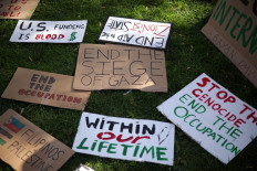 Signs that show support for Palestine are seen at Farragut Square during the National March on Washington for Palestine while calling for a ceasefire between Israel and Hamas on November 4, 2023 in Washington, DC, US. Israeli Prime Minister Benjamin Netanyahu has stated that there will be no ceasefire or pause in hostilities in the Gaza Strip until all of the hostages held by Hamas are released. 