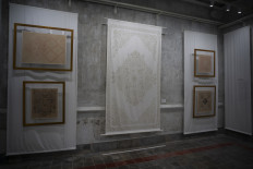 A wall display featuring ‘batik tulis’ (hand-drawn batik) is seen on Oct. 29, 2023 at the Angsukayana Mangkunegaran Batik exhibition, held at Sisworini Hall of Mangkunegaran Palace in Surakarta, Central Java.