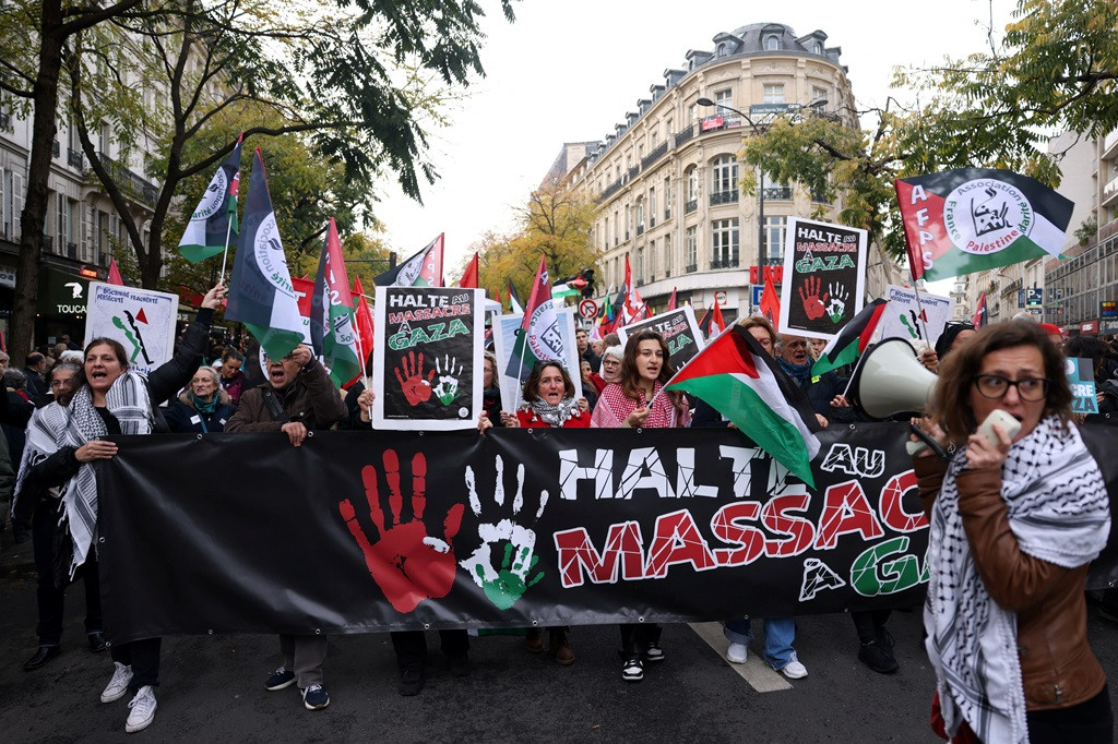 People take part in a demonstration in Paris, France, on Nov. 11, 2023,  demanding an immediate ceasefire in Gaza and in support of Palestinians in Gaza, as the conflict between Israel and Palestinian Islamist group Hamas continues.
