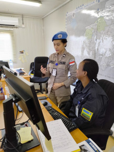 Indonesian policewoman First Brig. Renita Rismayanti (left) talks with a fellow officer from Rwanda at the United Nations Multidimensional Integrated Stabilization Mission in the Central African Republic (MINUSCA) in Bangui in this undated photo. Resnita has been named the 2023 UN Woman Police Officer of the Year.