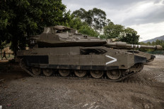 Israeli tanks are deployed in a kibbutz in the northern region of Kiryat Shmona near the border with Lebanon on October 30, 2023, amid increasing cross-border tensions.
