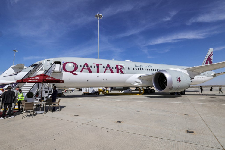 A Qatar Airways Boeing 787-9 jetliner aircraft is pictured on the tarmac during the 2023 Dubai Airshow at Dubai World Central - Al-Maktoum International Airport in Dubai, United Arab Emirates on Monday, Nov. 13, 2023.