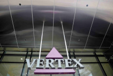 A sign hangs in front of the world headquarters of Vertex Pharmaceuticals in Boston, Massachusetts, US, October 23, 2019.   
